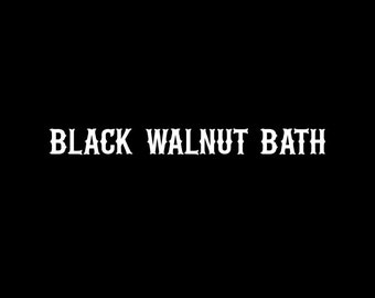 May include: Black Walnut Bath text in a white, stylized font on a black background.
