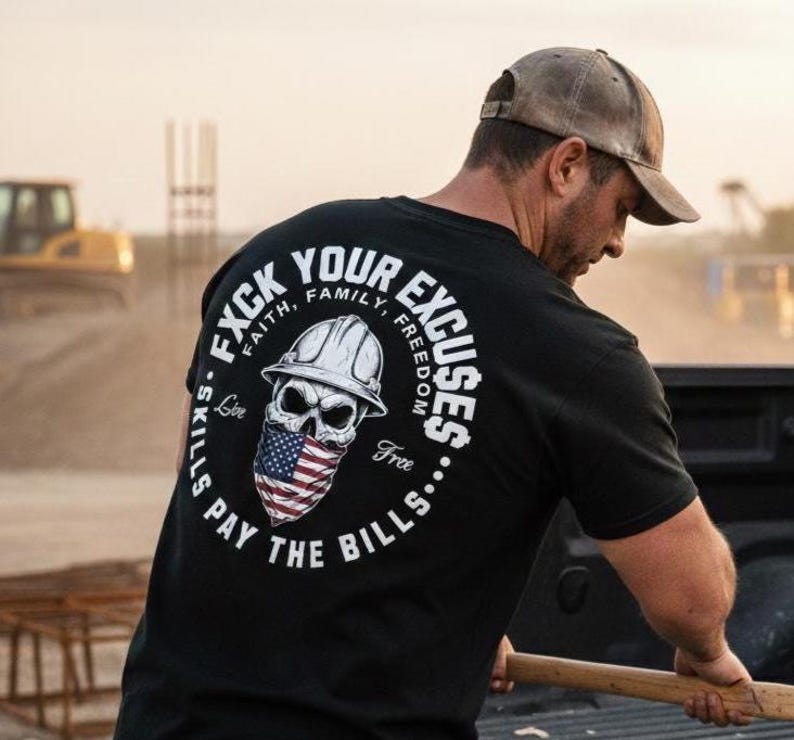 May include: Black t-shirt with a graphic on the back featuring a skull wearing a hard hat and an American flag bandana. The text around the skull reads "F*ck Your Excuses" and "Skills Pay The Bills."