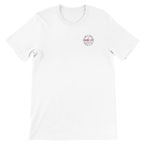 May include: A white short-sleeve t-shirt featuring a small circular graphic on the left chest. The graphic contains the text "CRANE LIFE" in red, surrounded by the words "SLOW IS SMOOTH" and "SMOOTH IS FAST" in black, with two crossed hammers above.