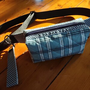 Cross Body Sling Bag with adjustable strap to fit small to extra large!  Two pockets inside and done in vintage and one of a kind prints!