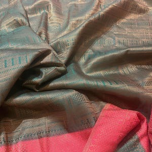 Semi soft silk dark green border with all over zari minute pattern and woven border.