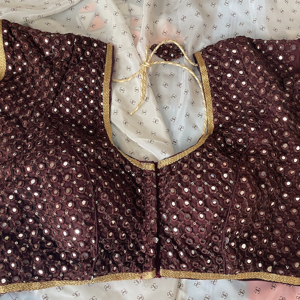 Dark Brown mirror work lehenga saree blouse size 32 to 38. Cotton with lining and pads short sleeve gold laced neck line with knots. Elegant