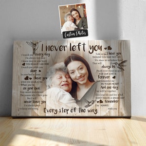 May include: A wooden sign with a sentimental message about love and loss. The sign features a photo of two women, one older and one younger, embracing. The text reads "I never left you every step of the way" and includes a poem about always being together in spirit.
