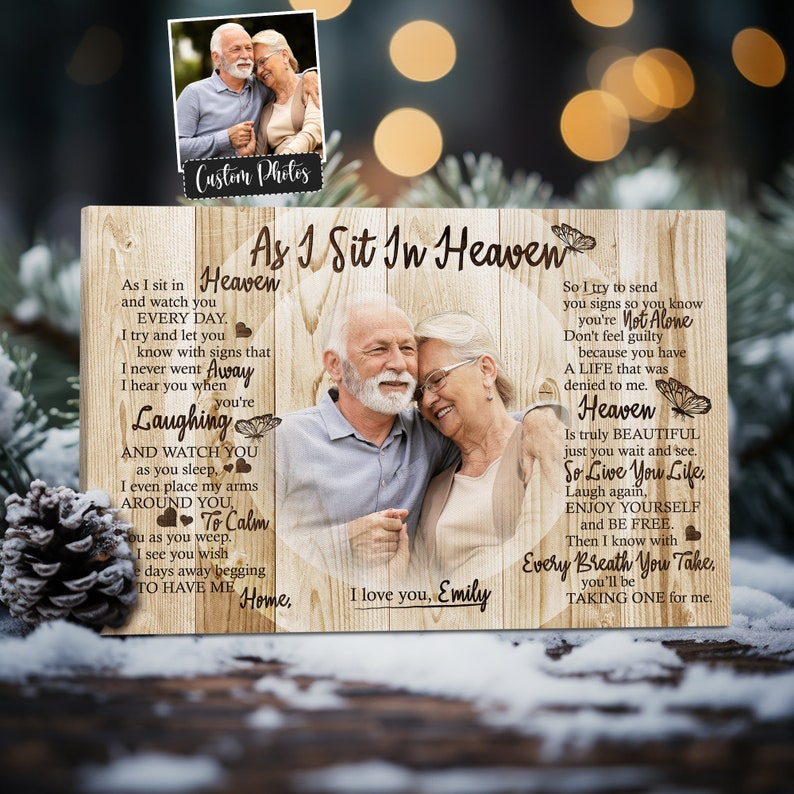 May include: A wooden sign with a photo of an older couple, a butterfly design, and the text "As I Sit In Heaven" and "So I try to send you signs so you know you're Not Alone. Don't feel guilty because you have A LIFE that was denied to me. Heaven Is truly BEAUTIFUL just you wait and see. So Live You Life, Laugh again, ENJOY YOURSELF and BE FREE. Then I know with Every Breath You Take, you'll be TAKING ONE for me."