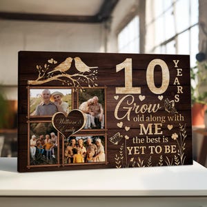 May include: A wooden framed photo collage with four family photos. The design includes the text "10 Years Grow old along with ME the best is YET TO BE". Decorative elements include birds, hearts, butterflies, and floral accents. The names "William & Emily" are also featured.