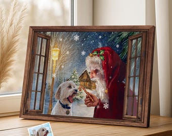 May include: A framed print depicts Santa Claus offering a candy cane to a white dog in a snowy winter scene. The artwork is framed in a dark brown wooden frame, with a smaller photo of the dog below.