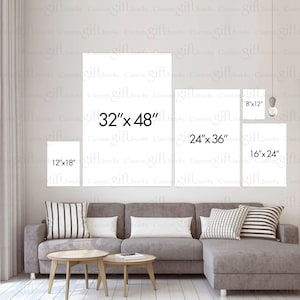 May include: A living room interior with a gray sectional sofa and three white framed canvases on the wall. The canvases are labeled with different sizes: 12" x 18", 24" x 36", 32" x 48", 8" x 12", and 16" x 24".