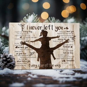 May include: A wooden sign with a silhouette of a father carrying a child on his shoulders. The sign has a message about love, loss, and remembrance. The text reads "I never left you. Every step of the way. I'm always with you."