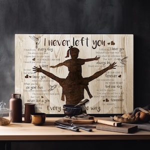 May include: A wooden sign with a silhouette of a father carrying a child on his shoulders. The sign has a brown wood grain background and features the text "I never left you" and a message about love and remembrance.