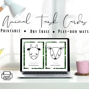 May include: Printable animal task cards with a giraffe and fox design. The cards are displayed on a laptop screen with a printer icon in the foreground. The text on the cards reads "Give the giraffe 8 spots" and "Give the fox orange fur".