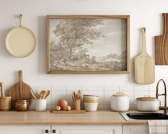 May include: A framed sepia-toned landscape print of a rural scene with trees, a river, and figures in the distance. The print is hanging on a white tiled wall in a kitchen setting.