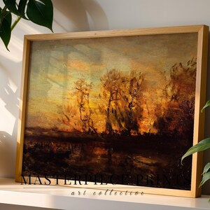Könnte beinhalten: Ein rechteckiges Landschaftsgemälde in einem hellen Holzrahmen, das einen Sonnenuntergang über einem dunklen, reflektierenden Gewässer mit baumartigen Silhouetten zeigt. Der Text "MASTERPIECE PRINTS art collective" ist in Schwarz aufgedruckt.