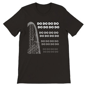 May include: Black t-shirt featuring a white graphic of a roller coaster and the text "DO DO DO DO" repeated several times.