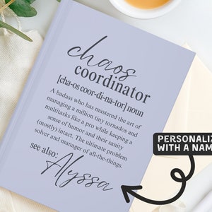 May include: A light purple notebook with the text "chaos coordinator" and a definition. The notebook is personalized with the name "Alyssa".