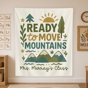 May include: A white tapestry with green mountains, a yellow sun, and the text "READY to MOVE MOUNTAINS" in brown lettering. The text "Mrs. Murray's Class" is written below the mountains.