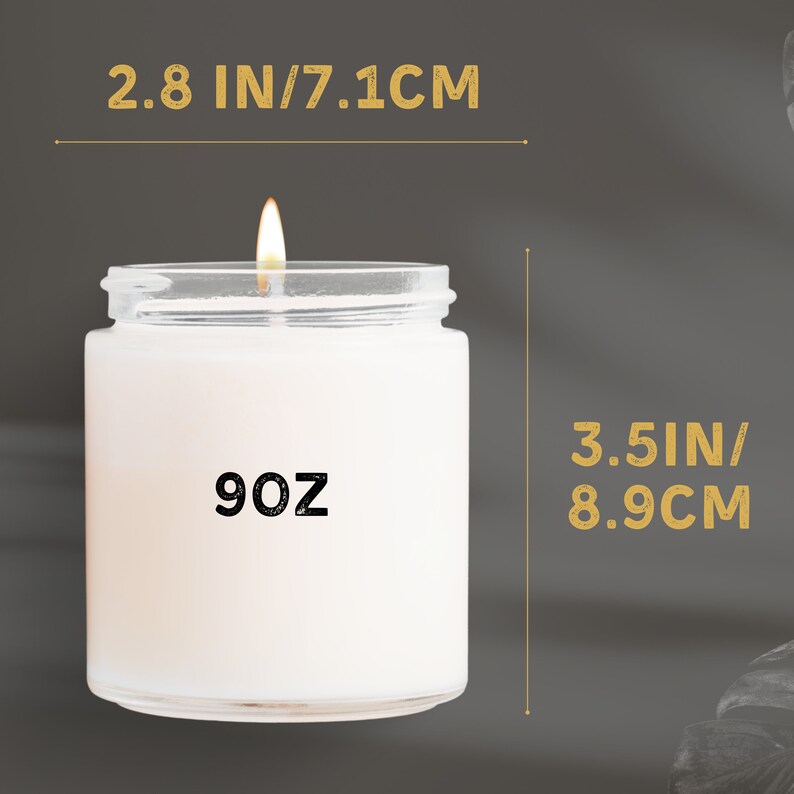 May include: A white candle in a clear glass jar with a black label that says "9 oz". The jar is 3.5 inches tall and 2.8 inches wide.