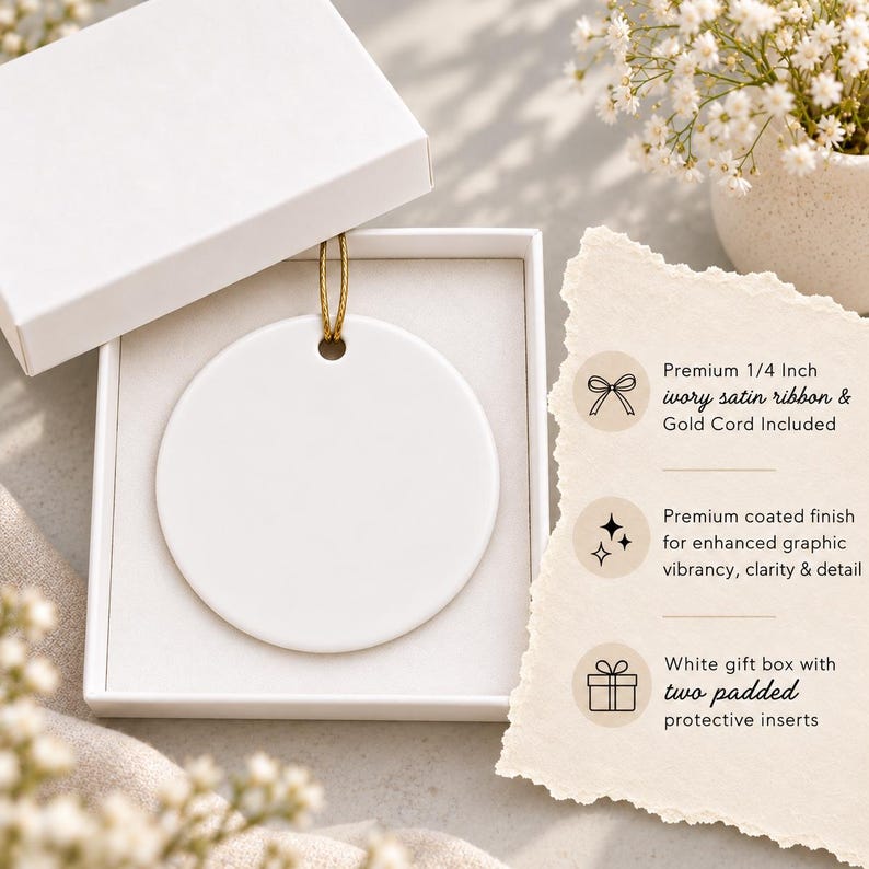 a white ceramic ornament placed in a white gift box with a gold cord, accompanied by a note detailing the ornament's features and benefits.