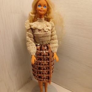 Vintage barbie with crocheted outfit