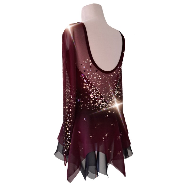 A new figure skating dress "Carmine" for performances and competitions. The dress is made in the ombre technique and hand-painted with an airbrush from carmine red to deep mahogany! Left back view