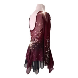 A new figure skating dress "Carmine" for performances and competitions. The dress is made in the ombre technique and hand-painted with an airbrush from carmine red to deep mahogany! Right back view