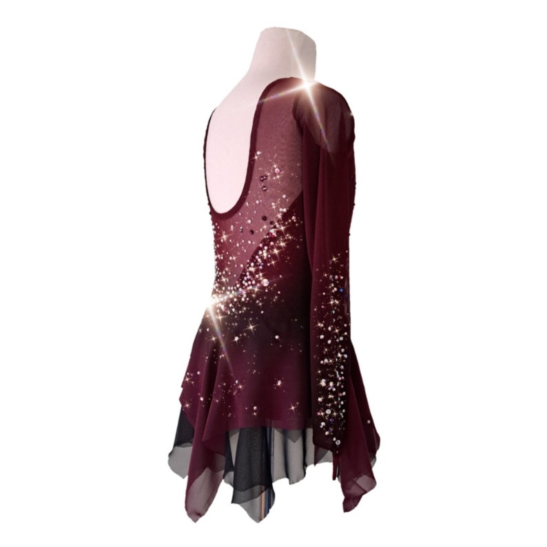 A new figure skating dress "Carmine" for performances and competitions. The dress is made in the ombre technique and hand-painted with an airbrush from carmine red to deep mahogany! Right back view