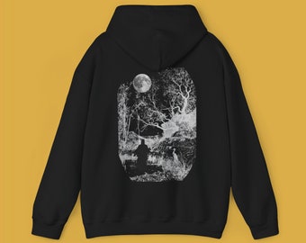 May include: Black hooded sweatshirt with a white graphic print of a moon, trees, and a person standing in a forest.