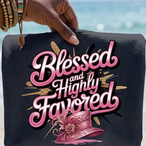 May include: A black tote bag with the words "Blessed and Highly Favored" in pink script. The design includes a pink hat with a rose and gold accents. The bag is held by a person with beaded bracelets.