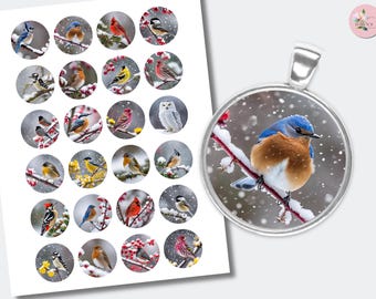 May include: A pendant with a round, silver-colored bezel featuring a detailed image of a bluebird perched on a snow-covered branch. The image is surrounded by a collection of circular images of various birds in winter settings. The background is a soft, snowy scene.
