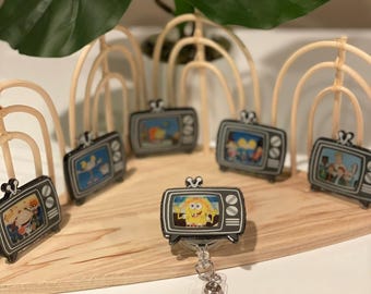 Vintage childhood TV badge reel