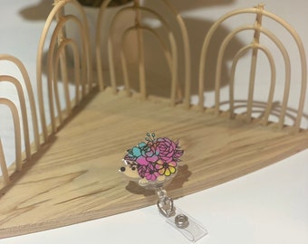Paint-splattered Hedgehog badge reel