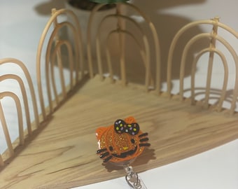 Halloween Hello Kitty Pumpkin badge reel