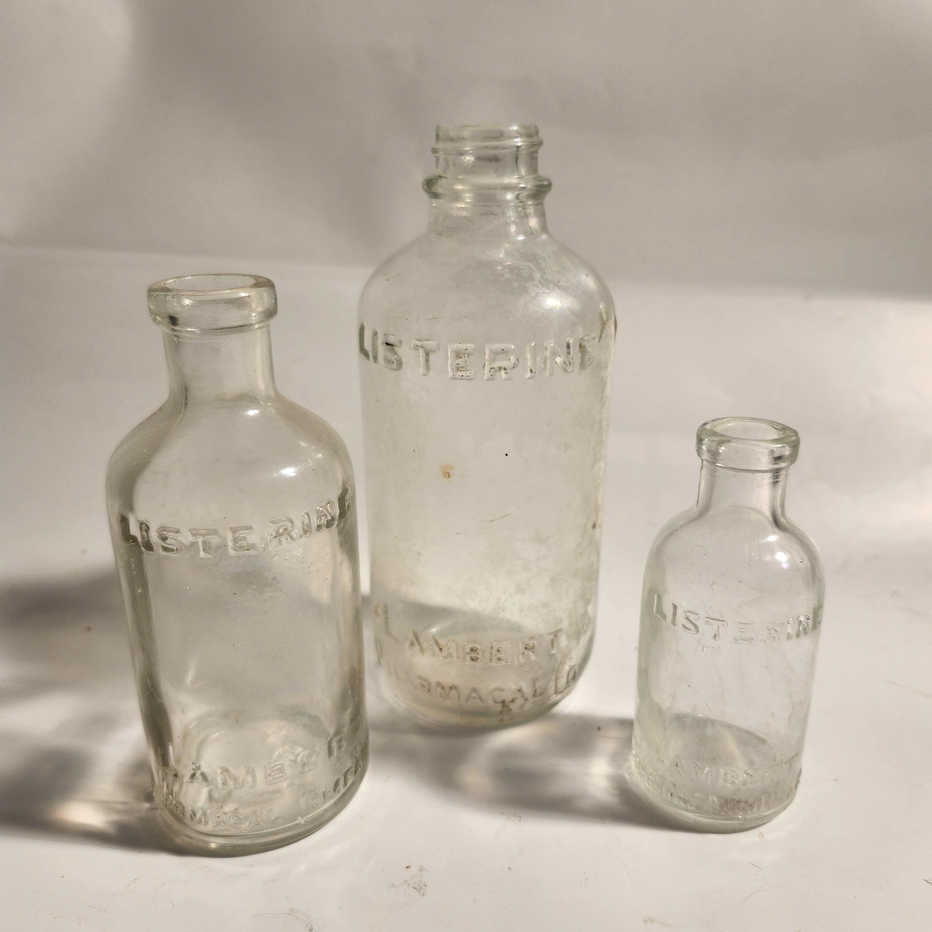 Vintage Antique Listerine Bottles (lot of 3), 1900s-1950s.