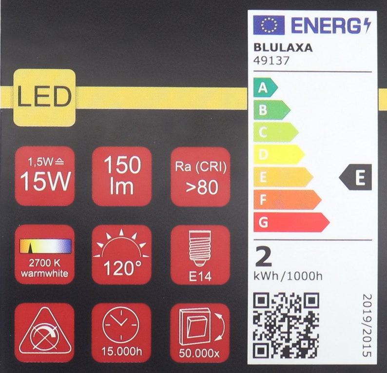 Pode incluir: Etiqueta de efici&ecirc;ncia energ&eacute;tica para uma l&acirc;mpada LED. A etiqueta mostra que a l&acirc;mpada &eacute; classificada como E, consome 15 watts, tem uma sa&iacute;da de luz de 150 l&uacute;mens, uma temperatura de cor de 2700K (branco quente), um &acirc;ngulo de feixe de 120 graus e um tamanho de base E14. A etiqueta tamb&eacute;m mostra que a l&acirc;mpada tem uma vida &uacute;til de 15.000 horas e &eacute; regul&aacute;vel.
