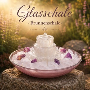 May include: A decorative glass fountain with the text "Glasschale - Brunnenschale". The fountain features a tiered design with a clear glass structure, surrounded by white crystals and purple gemstones, set in a pink bowl.