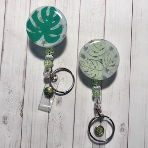 Tropical Leaf, Monstera Badge Reel Beautiful Greens with plant background: Gift for plant lovers, gardeners, teachers, medical staff, admin