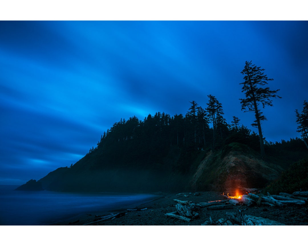Photograph of Campfire on Indian Beach at Night With Dramatic Clouds