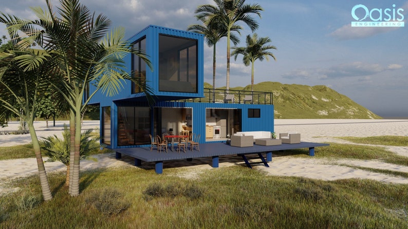 May include: A blue two-story container home with a wooden deck and a view of a beach and palm trees. The home has large windows and a modern design. The text "Oasis Engineering" is visible in the upper right corner of the image.