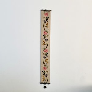 Long embroidered wall hanging with brass details. Vintage. Mid century modern.