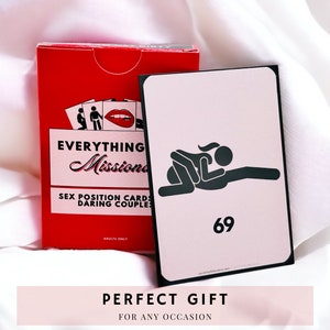 Everything But Missionary red card box laying on a white cloth. On top of the box is one of the pink background cards, the 69 sex position illustrated with stick figures. Perfect gift for any occasion!