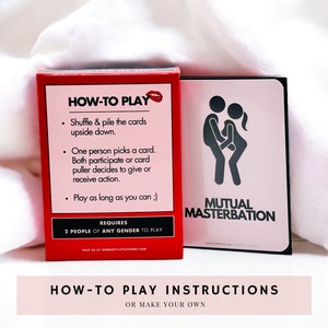 Everything But Missionary red card box laying on a white cloth, displaying the back of the box, which provides instructions on how to play. One sex position card is on display, illustrating mutual masterbation with stick figures!