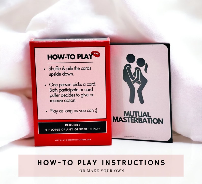 Everything But Missionary red card box laying on a white cloth, displaying the back of the box, which provides instructions on how to play. One sex position card is on display, illustrating mutual masterbation with stick figures!