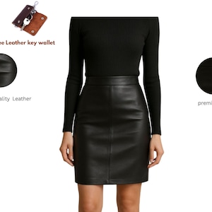 May include: A black leather skirt paired with a black long-sleeve top. The image also includes a free leather key wallet. The skirt is made of premium quality leather and features premium stitching.