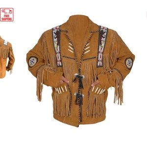 May include: A brown suede jacket with fringe and beading details. The jacket has a button closure and two pockets. The jacket is decorated with Native American inspired designs.