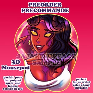 May include: A 3D mousepad featuring a cartoon devil woman with red skin, black hair, and yellow eyes. The mousepad has the text "PREORDER PRECOMMANDE" and "3D Mousepad". The background is pink.