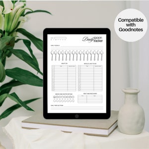 May include: A black and white digital planner with the text "Daily Spoon Tracker" and a spoon graphic. The planner includes sections for daily goals, must do, would like to do, mood and water intake, rest and recovery, and daily reflection. The planner is compatible with Goodnotes.
