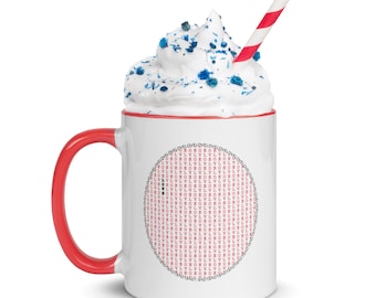 Può includere: Una tazza in ceramica bianca con un manico rosso. La tazza ha un design circolare rosso con la parola "LOVE" ripetuta molte volte. La tazza è piena di panna montata e codette blu. Una cannuccia a righe rosse e bianche è nella tazza.