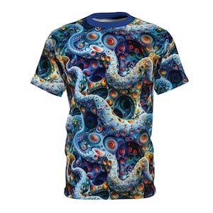 May include: A short-sleeved t-shirt with a striking, all-over print. The design is an abstract pattern of swirling blue, orange, and yellow shapes, reminiscent of tentacles and circular forms. The shirt has a blue collar and a fitted cut.