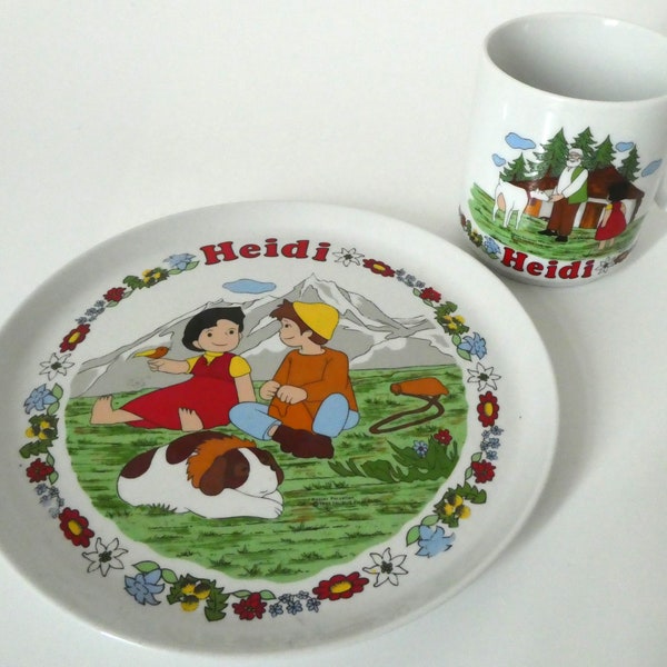 Kindergeschirr von Rösler mit Motiven aus dem Zeichentrickfilm Heidi von 1986, Becher mit Heidi und Großvater, Teller mit Heidi und Peter