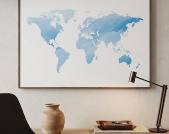 May include: A rectangular wall art piece featuring a world map with continents rendered in varying shades of blue with a brushstroke texture against a plain white background, enclosed within a thin, dark brown wooden frame.