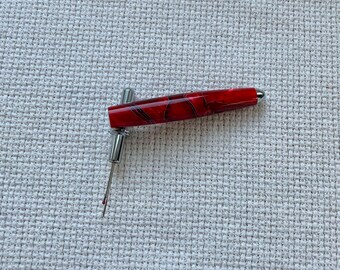 Black and red acrylic seam ripper